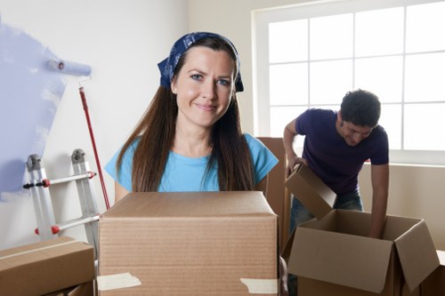 Professional movers protecting furniture during a Harringay house move