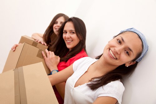 Local office move preparation with labelled boxes and equipment