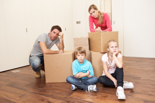 Local movers handling boxes and furniture near Harringay streets